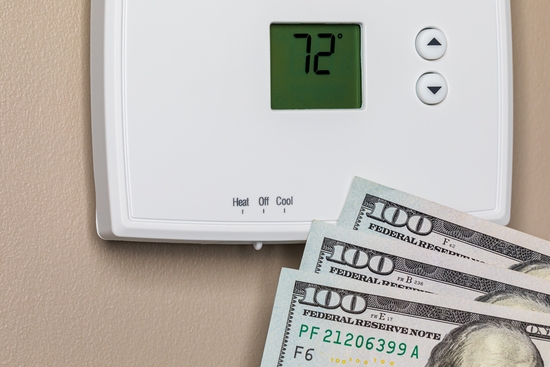 Thermostat,For,Home,Furnace,And,Air,Conditioner,With,Cash,Money.