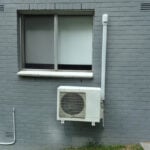 small ac unite attached to a wall