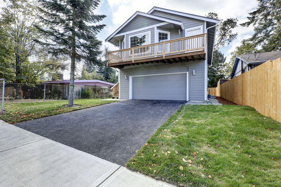 Exterior,Of,Two,Story,Clapboard,Siding,House,With,Large,Wooden